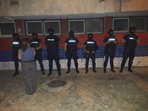 Serbian police guarding some random wall on random residential building...