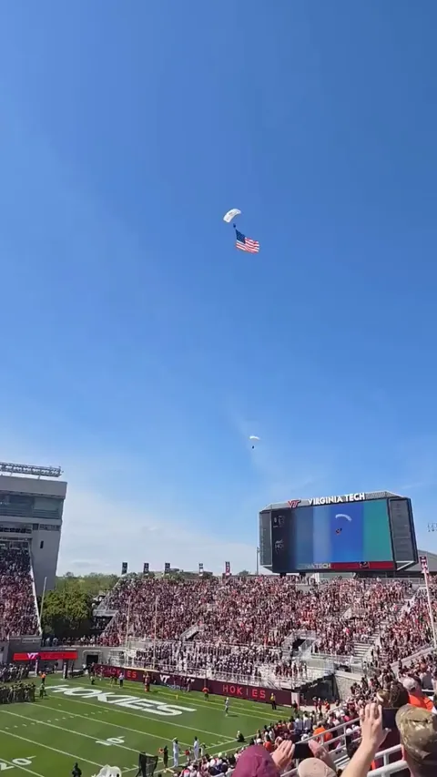 Man parachuting into Virginia Tech Spring game is stuck on the scoreboard after rough collision