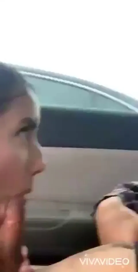 Smiling while giving him the first blowjob of his life