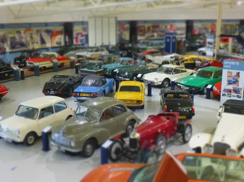 No, these are not toys. These are real cars. This is done with the help of a tilt shift lens.