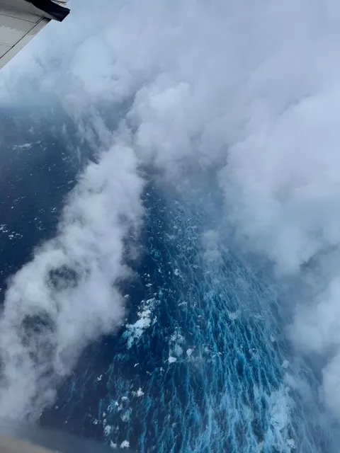 The eyewall of Category 5 Hurricane Erin. Calm ocean to the left, ferocious waves to the right