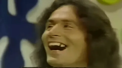Serial killer and rapist Rodney Alcala laughing after winning a date with Cheryl Bradshaw on The Dating Game in 1978.