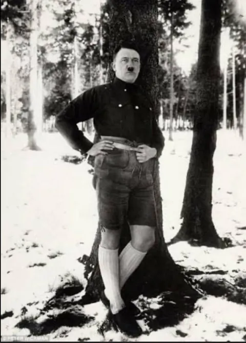 Hitler posing whilst wearing Lederhosen (1930). He said the photo made him look weak