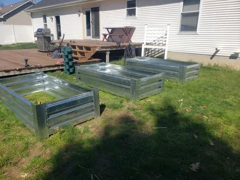 Was able to snag some galvanized decking from work, our new garden boxes are coming together nicely 