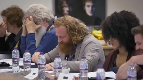 Conleth Hill at the table read reacting to his character's death in final season of Game of Thrones.
