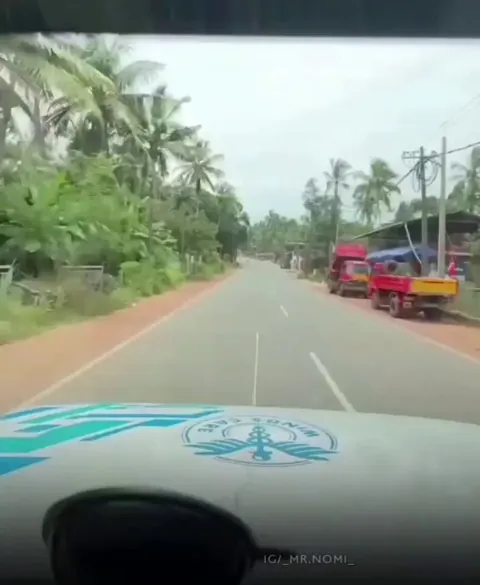 Ambulance overturns after narrowly avoiding hitting a motorbike.