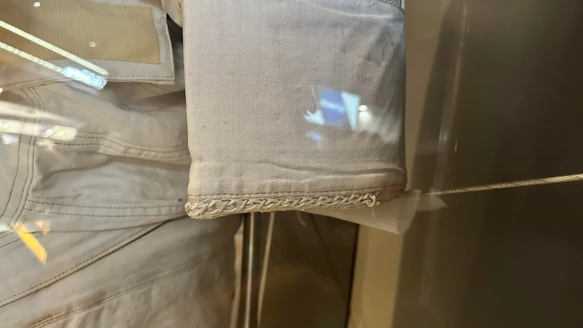 Why is the spacewalk suit sewn this way?