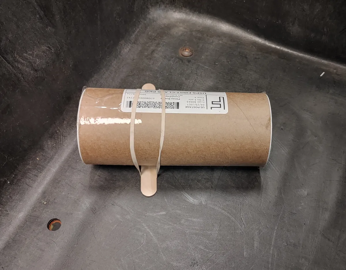 A customer mailed this tube with a tongue depressor attached to it to prevent it from rolling around.