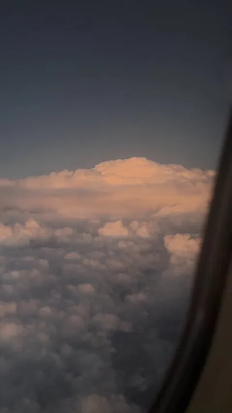 🔥Full moon rising over thunderclouds on my flight