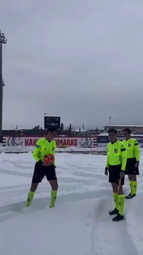 Scenes in the Turkish 3rd tier, as the referee carries out a pitch inspection despite there being more than a foot of snow on the grass. Eventually, game off.