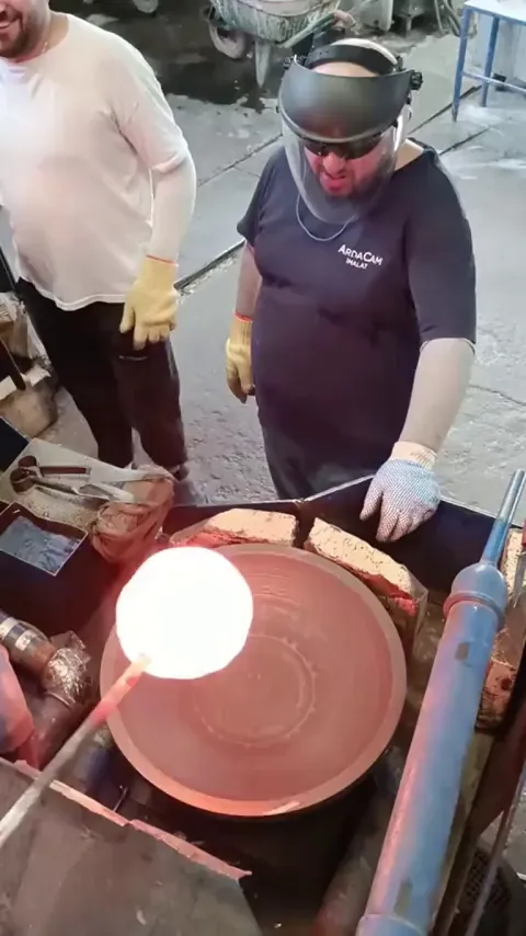 molten glass is spun into shape