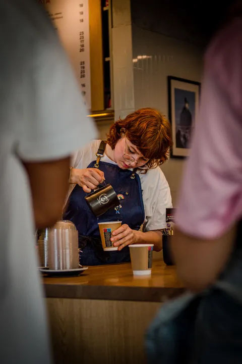ITAP of a barista preparing coffee