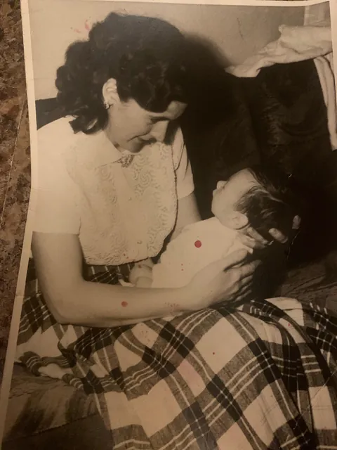 My dad a few days old in 1957.