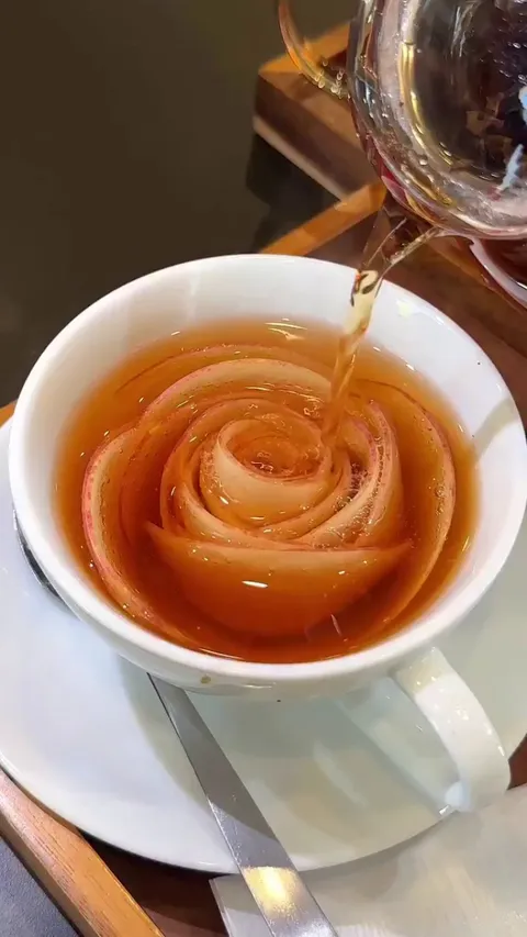 At Oyoppi Cafe in Tokyo, the 'blooming apple tea' features thin apple slices that seemingly blossom as hot tea is poured over them.