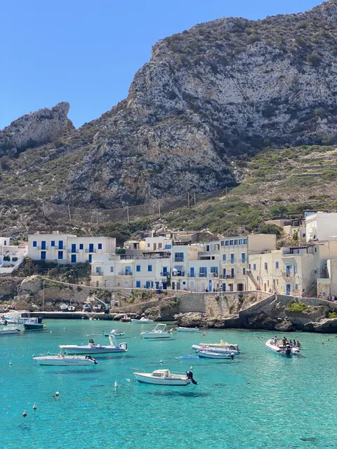 The water is so clear, that it looks like the boats are levitating.