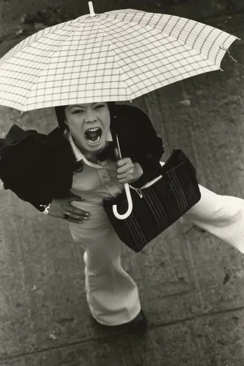 In 1974, Masahisa Fukase photographed his wife, Yōko Wanibe, every morning from the window of their apartment in Tokyo as she left for work.