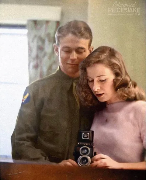 U.S. Army Air Forces 2nd Lieutenant Quentin C. Aanenson takes a mirror selfie with his girlfriend Jacqueline Greer before leaving for Europe, c. March 1944