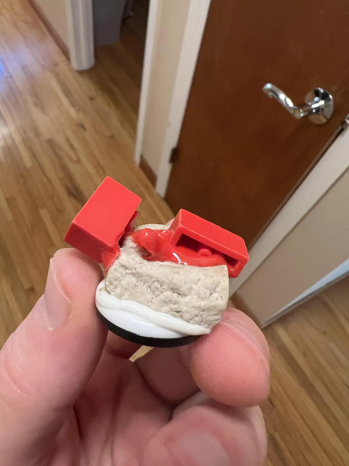 Legos fused to an eraser after being stored in a box together for over a decade