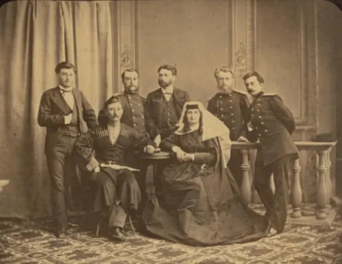 My 3rd great grandmother with her 12 children. Late 1870s