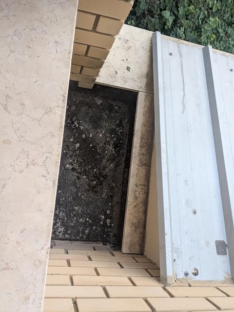 Got this secret little square of nothing in my dorm room, thinking of putting dirt in it and growing something. Give me your best/craziest ideas.