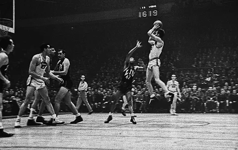 1946, Madison Square Garden, Kenny Sailors shoots the first-ever Jump Shot in Basketball History. Players were trained to never leave the floor on defense and most especially offense.