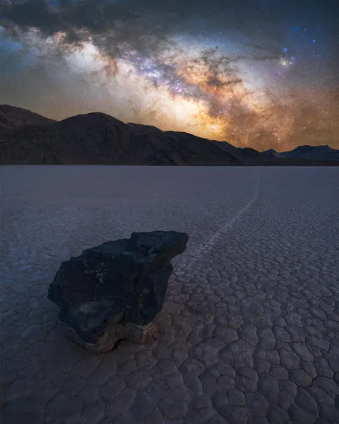 Milky Way Core rising above a sailing stone in Death Valley National Park