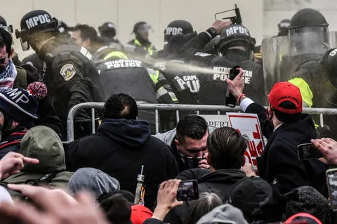 Pro-Trump rioters attacking Capitol police with bear spray on Jan 6th.