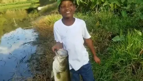 This little guy catches a huge fish then does the unexpected.