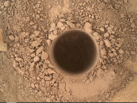 It may look like just a hole in the dirt, but this is the first sampling hole made by the Curiosity at Mt. Sharp, the rover's ultimate science destination.