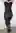 This black dress hugs every curve. 51yo