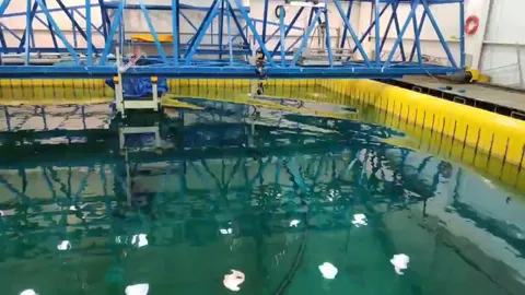 A perfect standing wave on a computer controlled wave pool used for research in a university of Brazil