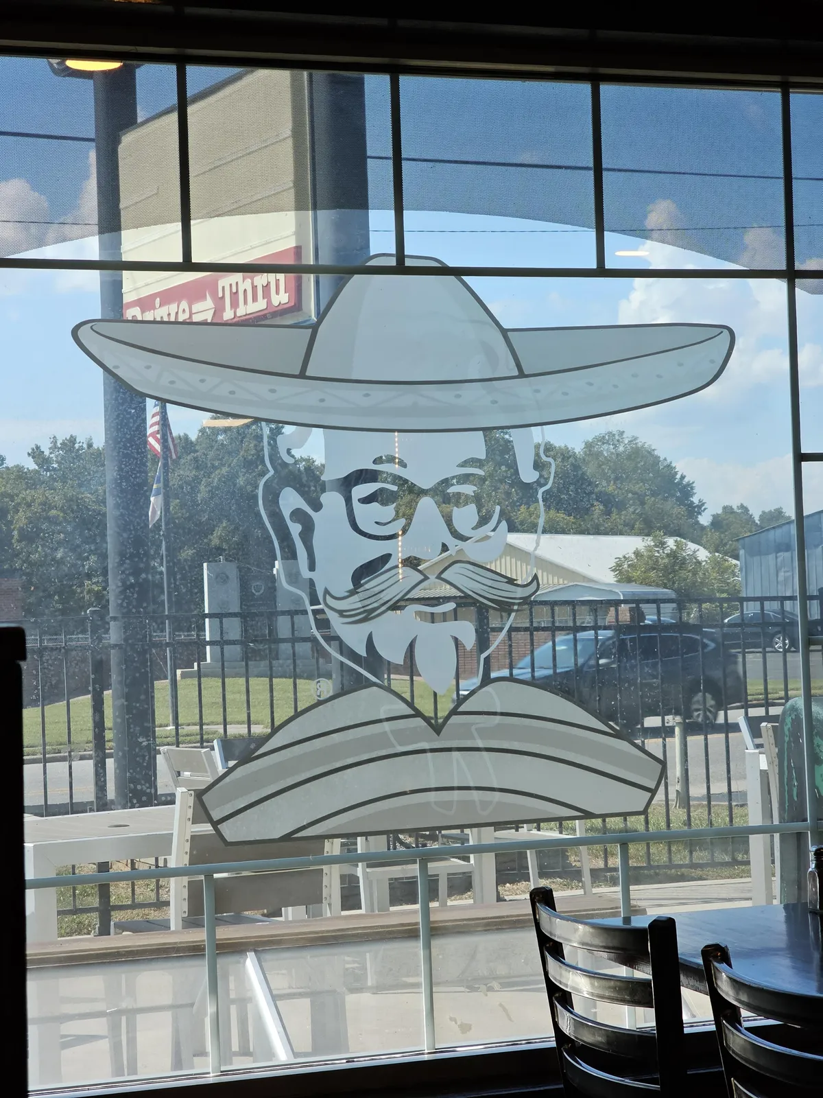 This mexican restaurant used to be a KFC and they just painted a sombrero, mustache, and poncho over the Col. Sanders images.