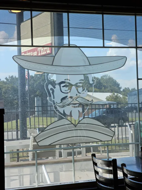 This mexican restaurant used to be a KFC and they just painted a sombrero, mustache, and poncho over the Col. Sanders images.