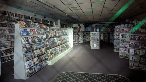 A couple months ago I posted the front of an abandoned movie store in KY. This weekend I went by again and realized the store was left with everything inside still on the shelves.