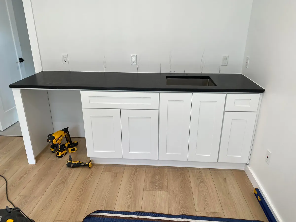 3 year garage/studio apartment build, cost ~$70,000 and one marriage