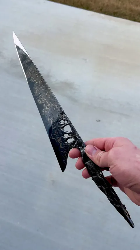 A blade I forged from a 4.5 billion year old meteorite, the ‘Muonionalusta', one of the oldest meteorites ever recorded... It's crafted into a damascus steel, with both 24k gold and 14k gold with pearls inset into the handle