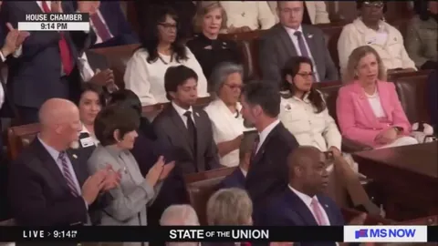 Rep. Al Green is ejected from the State of The Union after holding up a sign reading ‘Black People Aren’t Apes’