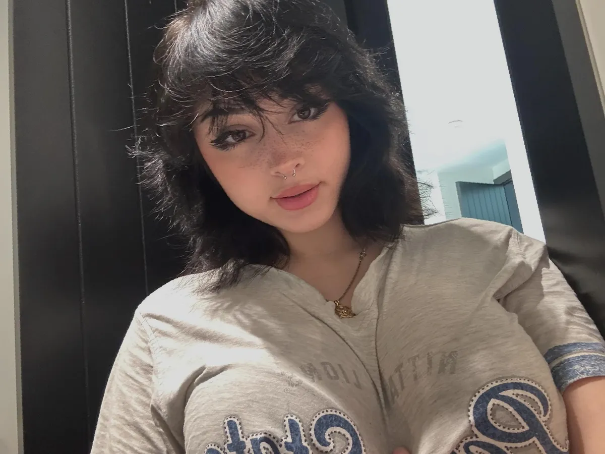 the curves underneath the shirt is stealing focus...