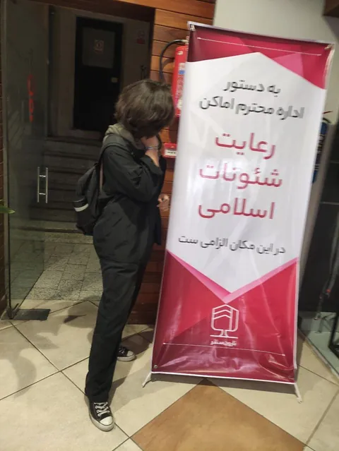 Iranian women making it a trend to take photos without hijab next to signs and billboards of hijab advertisement in Iran. 