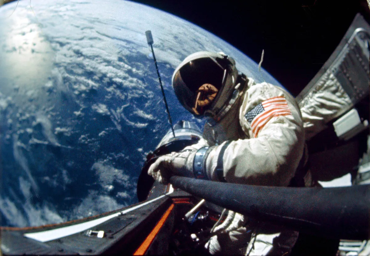 2nd man on the moon Buzz Aldrin preforming a space walk on the Gemini 12 mission