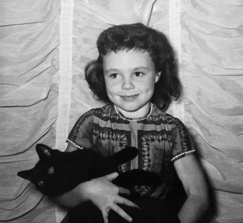 Holding my first very own cat, 1959