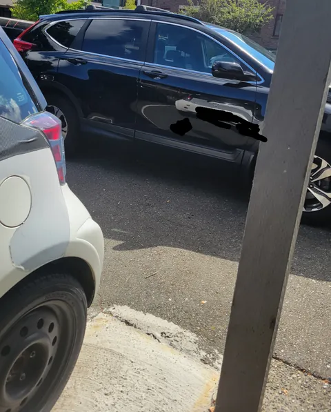 Neighbor with their own designated spot parked right behind my car.