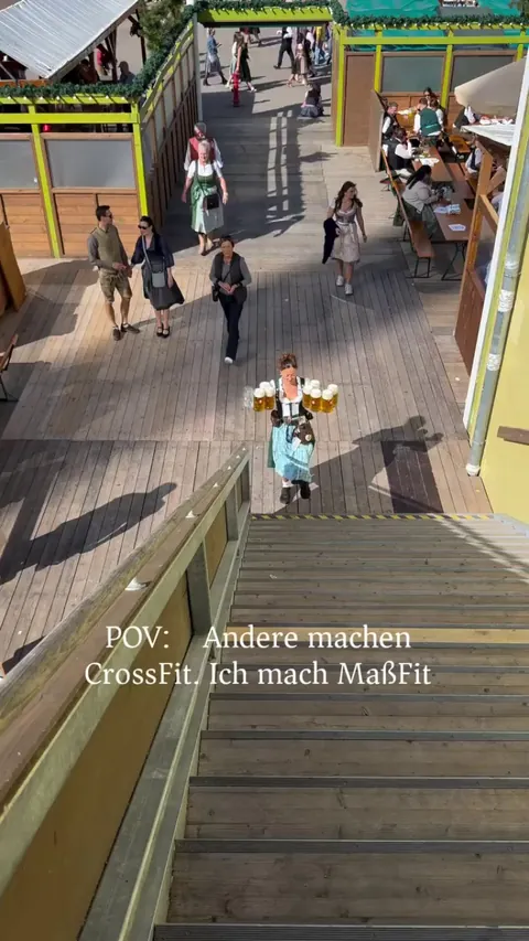 Carrying 8 full beer mugs (around 18 kg) up the stairs at Oktoberfest with a caption: "Others do CrossFit. I do MaßFit."