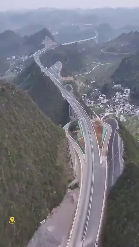 Mountains sliced in half for China's sky-high highway