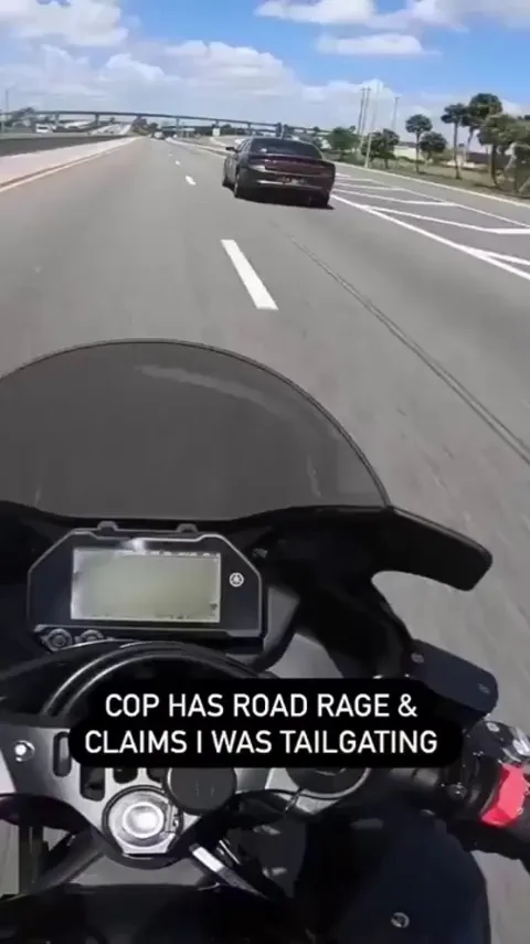 Police car brake checks a motorcycle