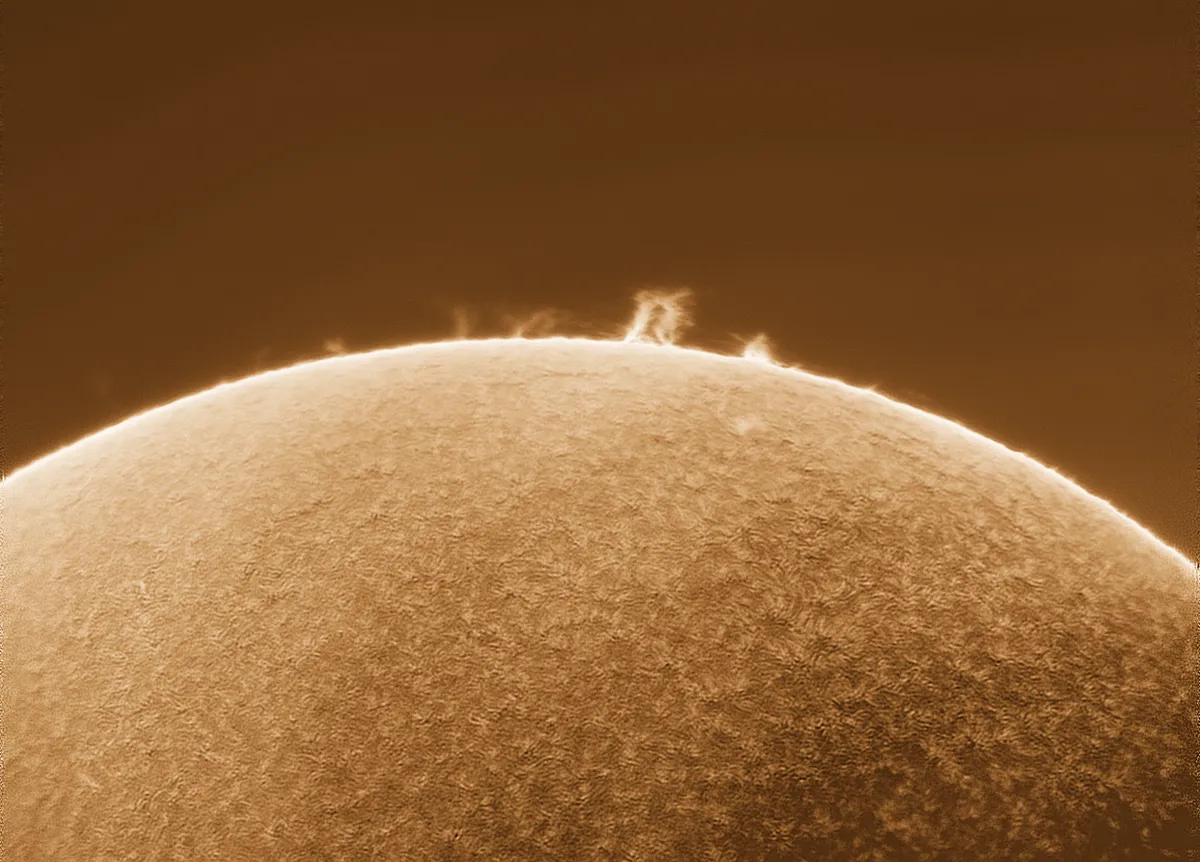 A massive eruption on the sun just happened a few moments ago and I was able to capture it from my backyard. At least two Earths could fit in that loop. [OC]