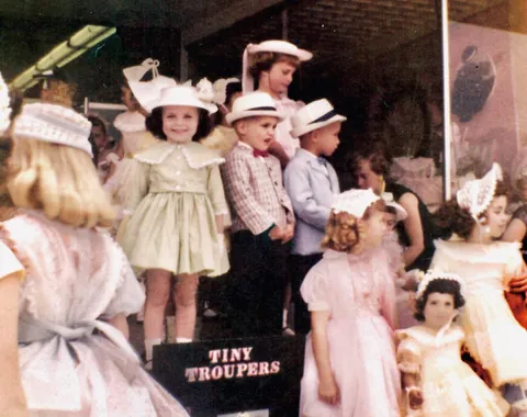 So happy smiling at my mom in the dress she made specially for the Easter parade at the mall. 1959