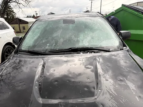 A storm with egg sized hail wrecked my car while at work