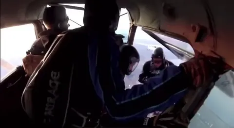 Two planes crash in the air while skydiving.