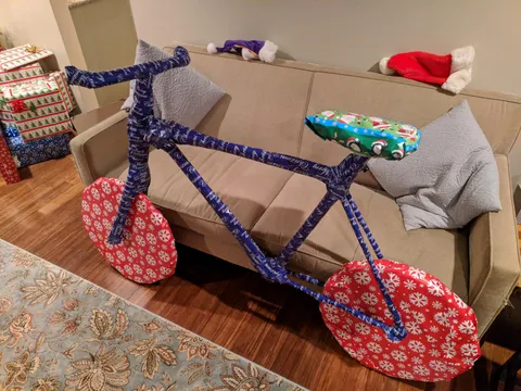 Bought my brother tree trimmers for Christmas, built a cardboard frame around them and wrapped them like this.